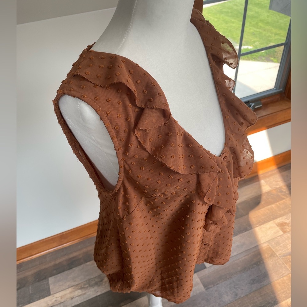 Ruffled sleeveless blouse